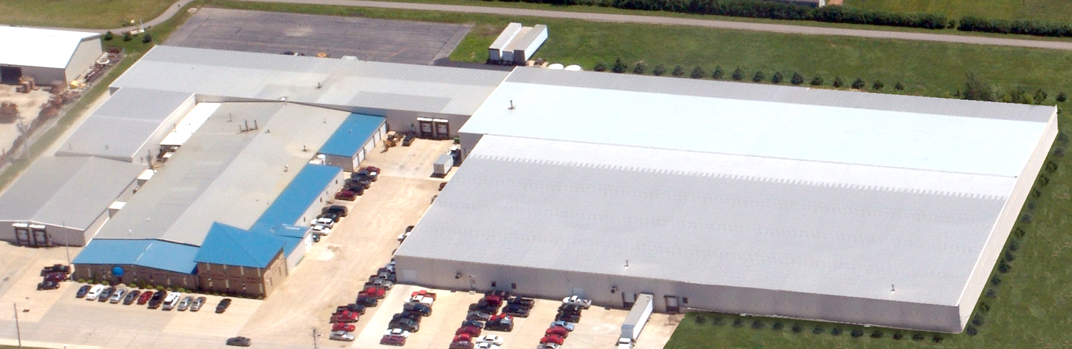 A picture of Precision of New Hampton’s building and warehouse.